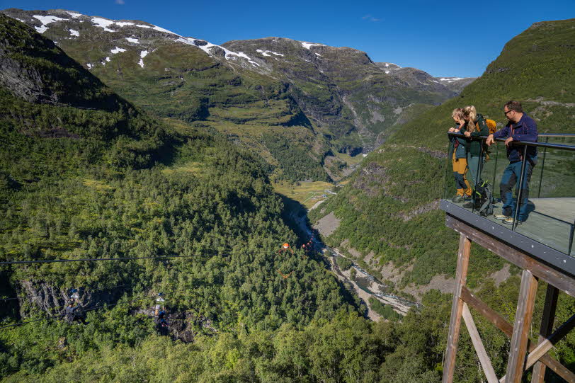 Two adrenaline 'junkies' fly next to eachother down the Flam valley on the Flam Zipline