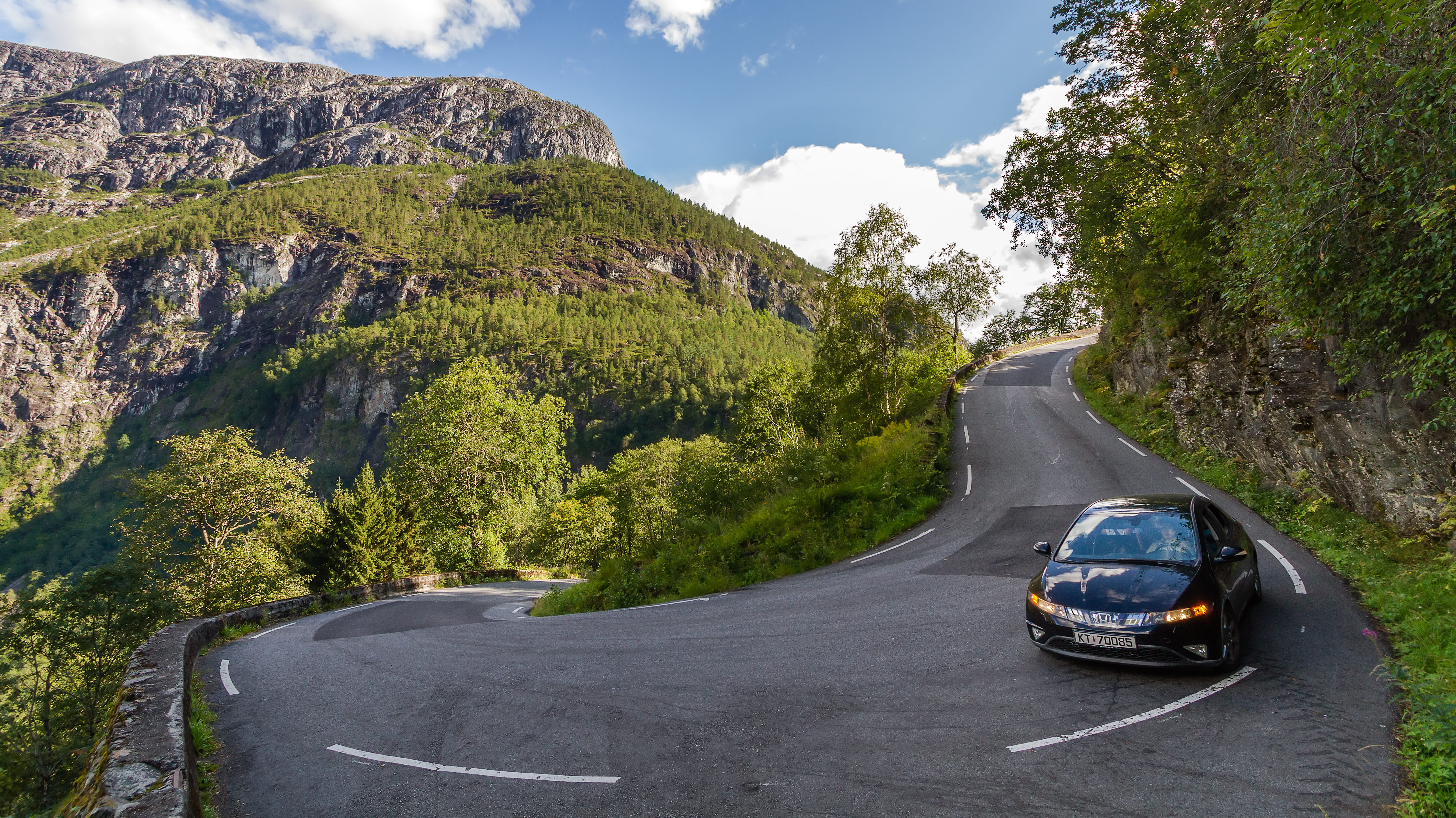 A car heading down Stalheimskleiva on a summer day