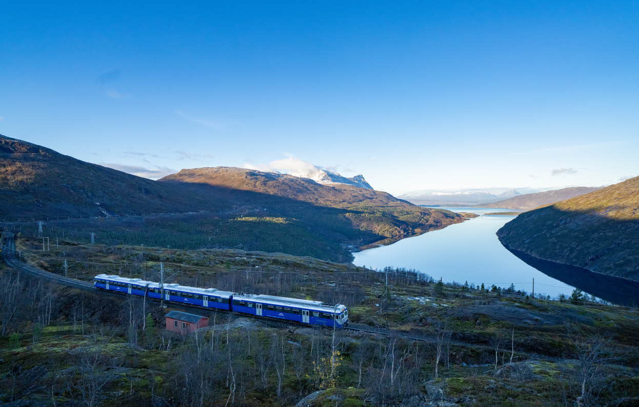A clear autumn day along the Ofot line with The Arctic Train in front