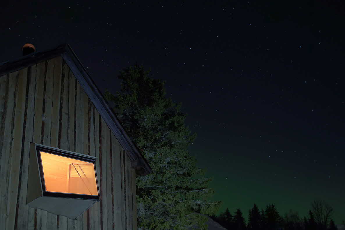 A window in Tråfjosen in Myrkdalen shines out on a clear evening